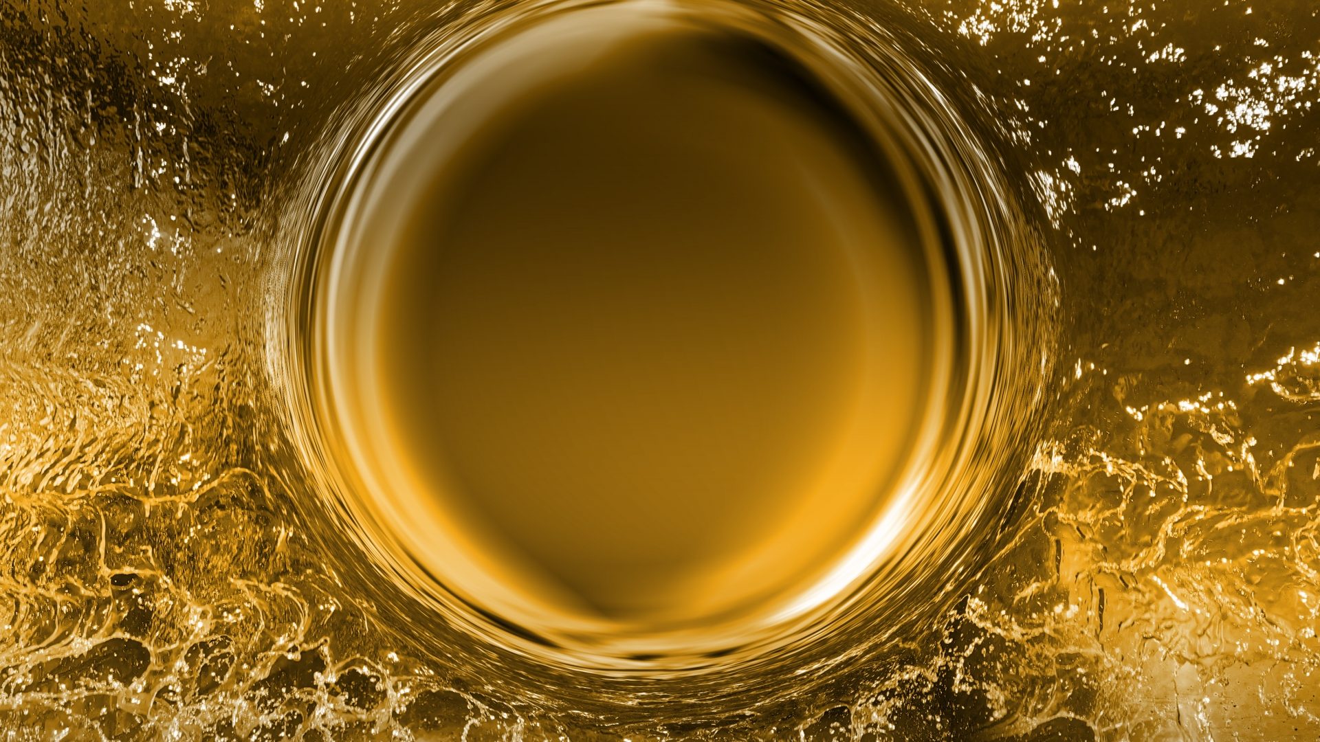 金色の水面に波紋が広がる様子を捉えた画像。